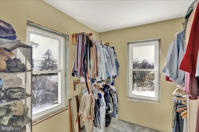 a view of a closet with storage