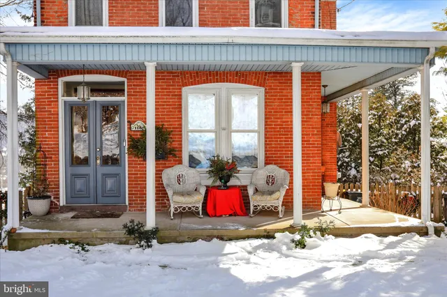 a front view of house with outdoor seating