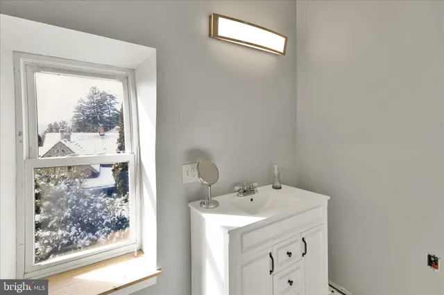 a utility room with a sink dryer and main door