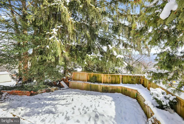 a view of a patio with dining table and chairs with potted plants