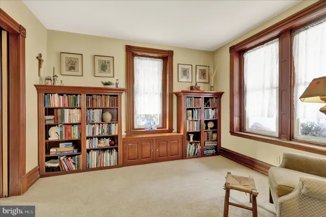 a livingroom with a large window and a couch