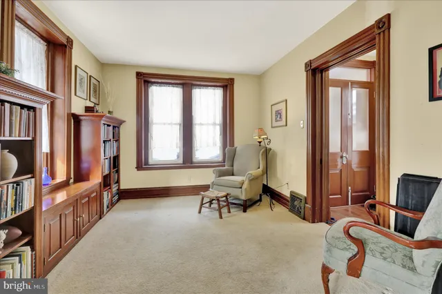 a view of an entryway with workspace and windows