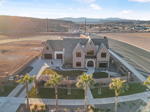 1468 South Red Cliffs Temple Lane St. George, UT 84790 - Photo 58 of 64 Aerial view of property and surrounding area with a mountain backdrop
