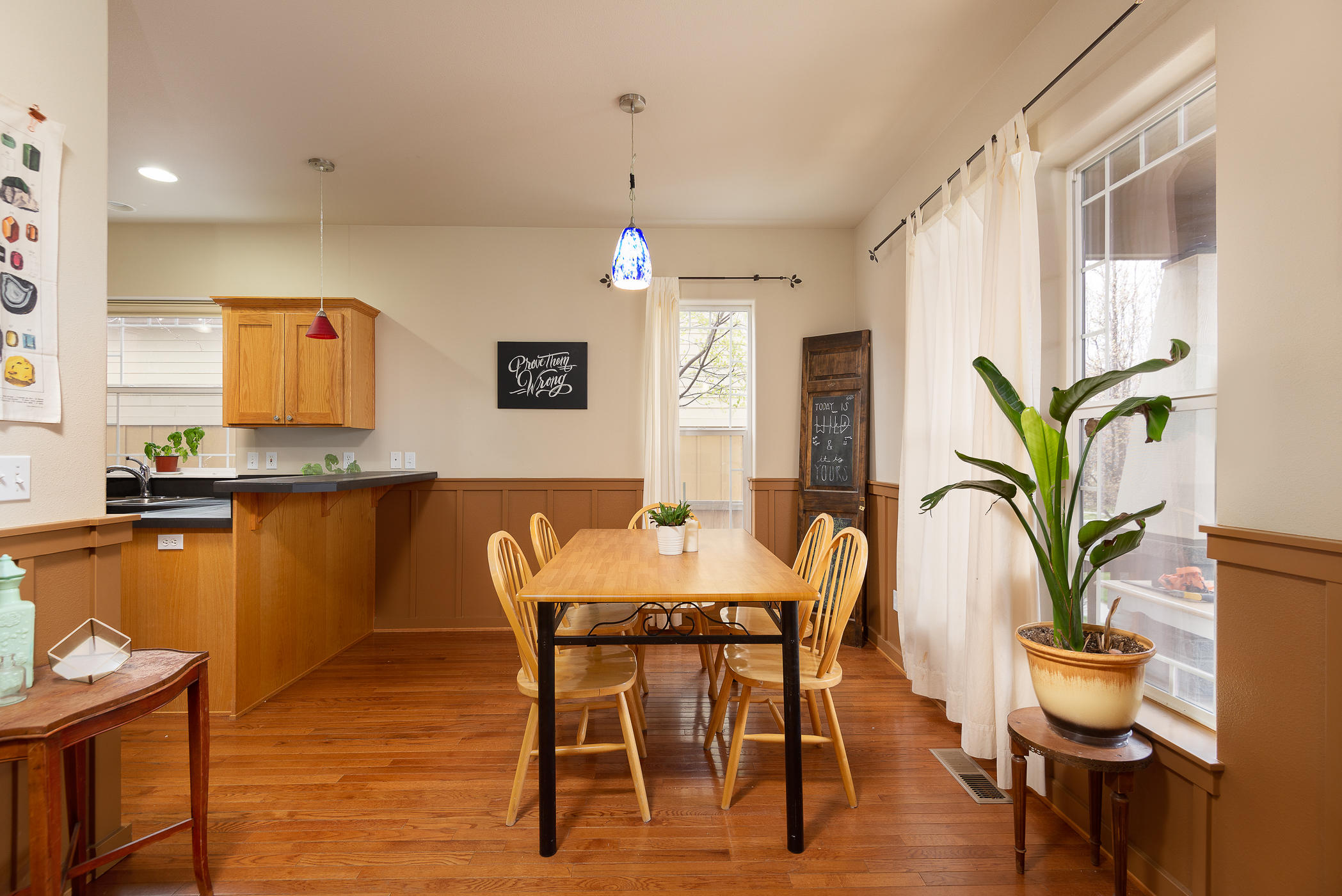 62737 Larkview Road Bend, OR 97701 - Photo 6 of 21 a view of a dining room with furniture window and wooden floor