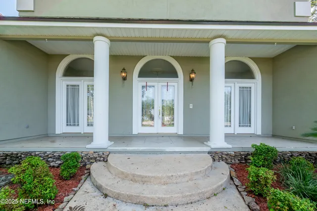 a view of a hallway with staircase