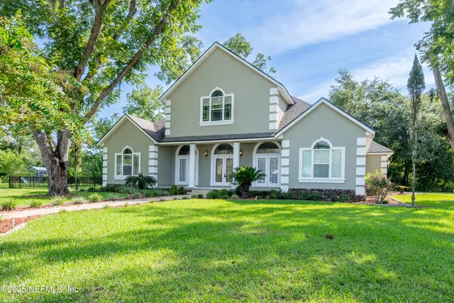 a view of street with houses in background