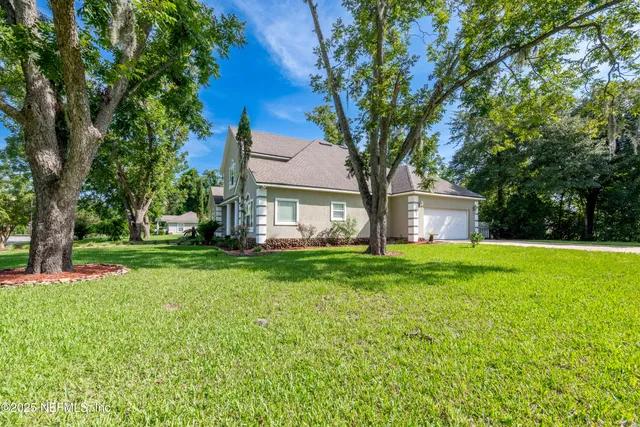a front view of a house with a yard and porch