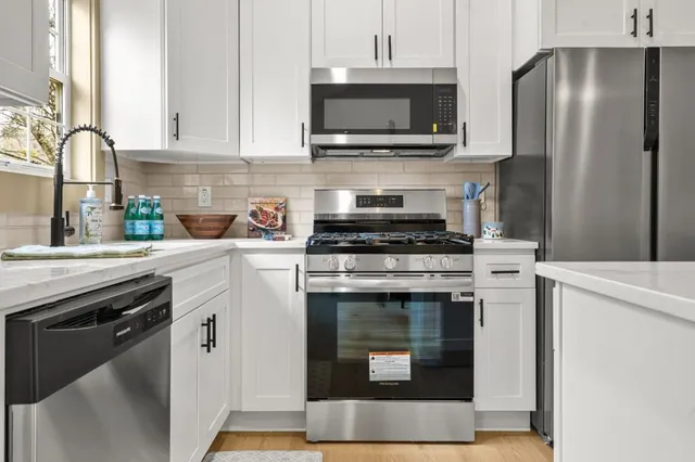 a view of a chairs and table on the wooden floor