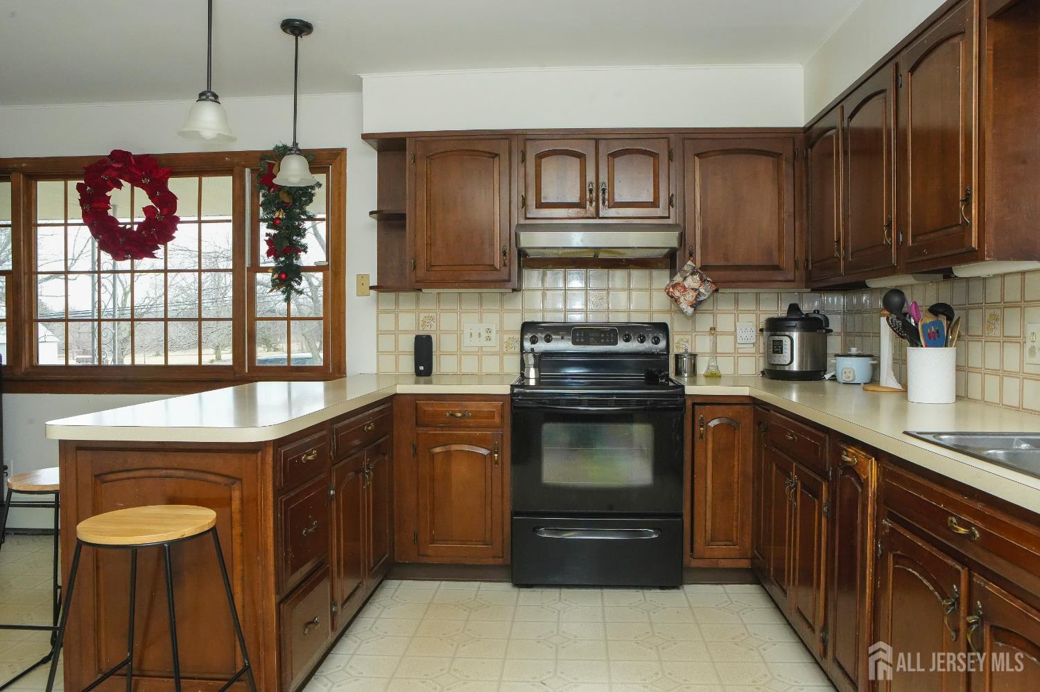 168 Line Road West Windsor, NJ 08550 - Photo 3 of 12 a kitchen with stainless steel appliances granite countertop a stove top oven a sink dishwasher and a microwave oven with cabinets