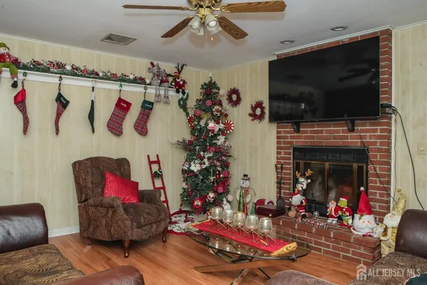 a living room with furniture fireplace and flat screen tv