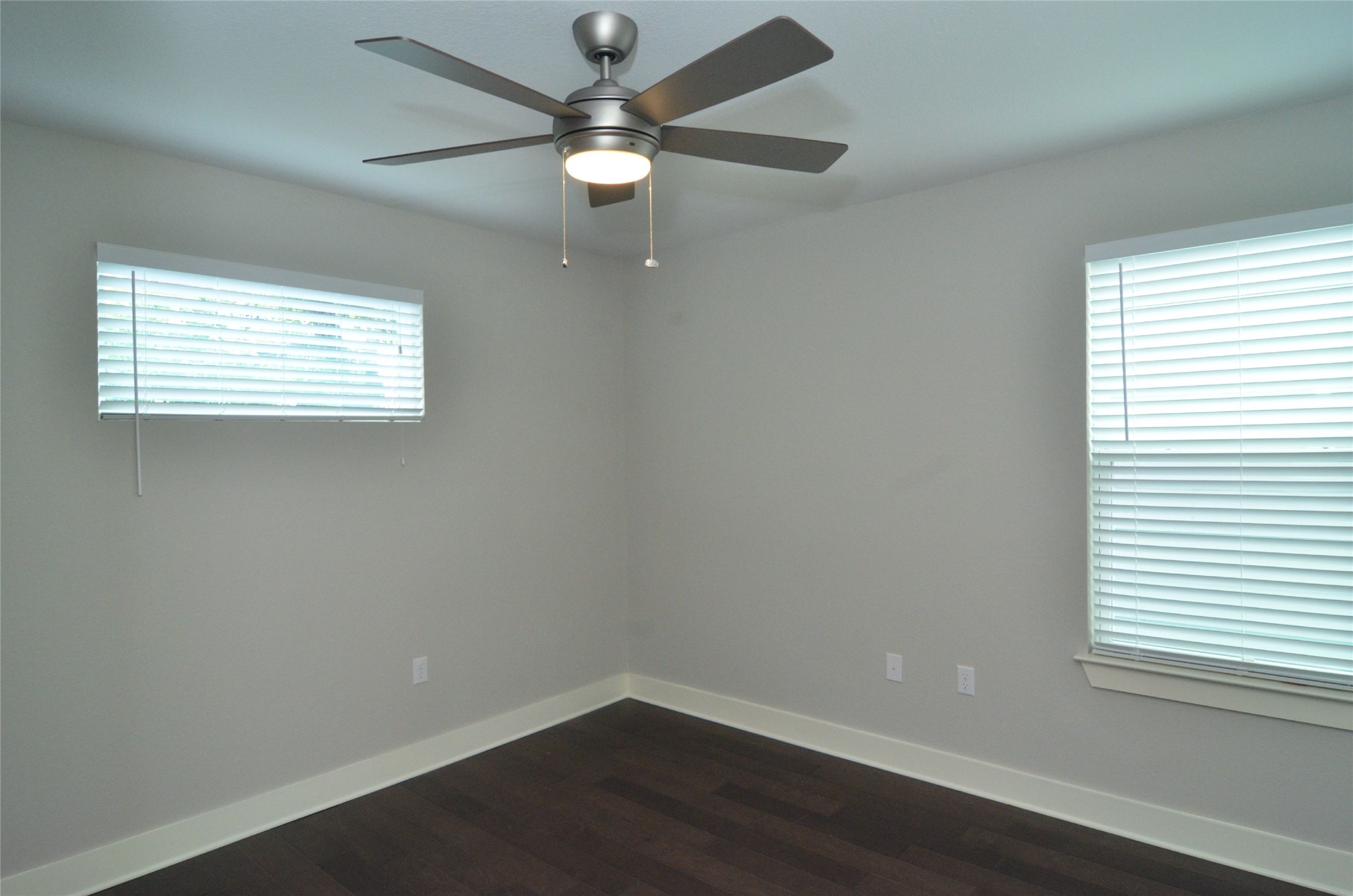 1916 Cleese Drive Austin, TX 78741 - Photo 22 of 36 Rich hardwood floors complement a neutral palette, with windows welcoming ample natural light.