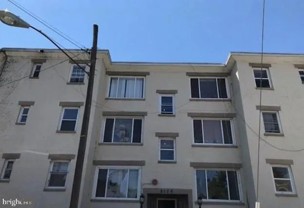 a front view of a building with glass windows