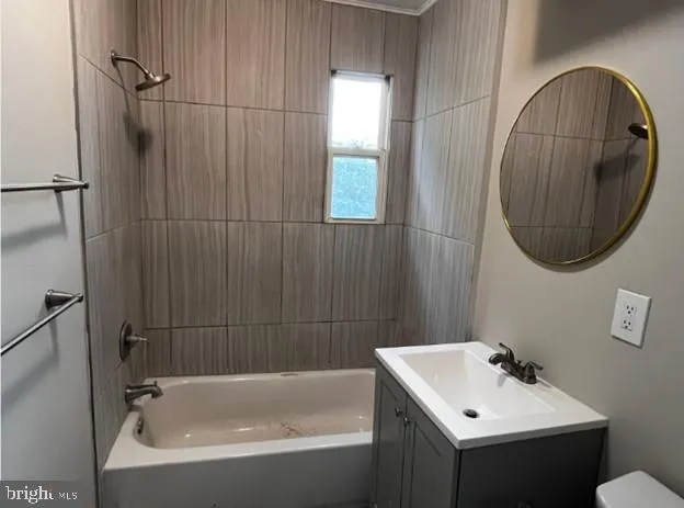 a bathroom with a sink a bathtub and a mirror