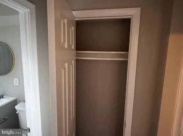 a view of bathroom with a toilet and a sink