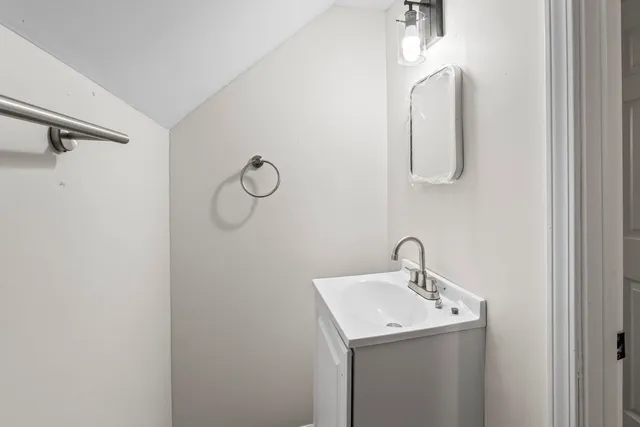 a bathroom with a sink and mirror