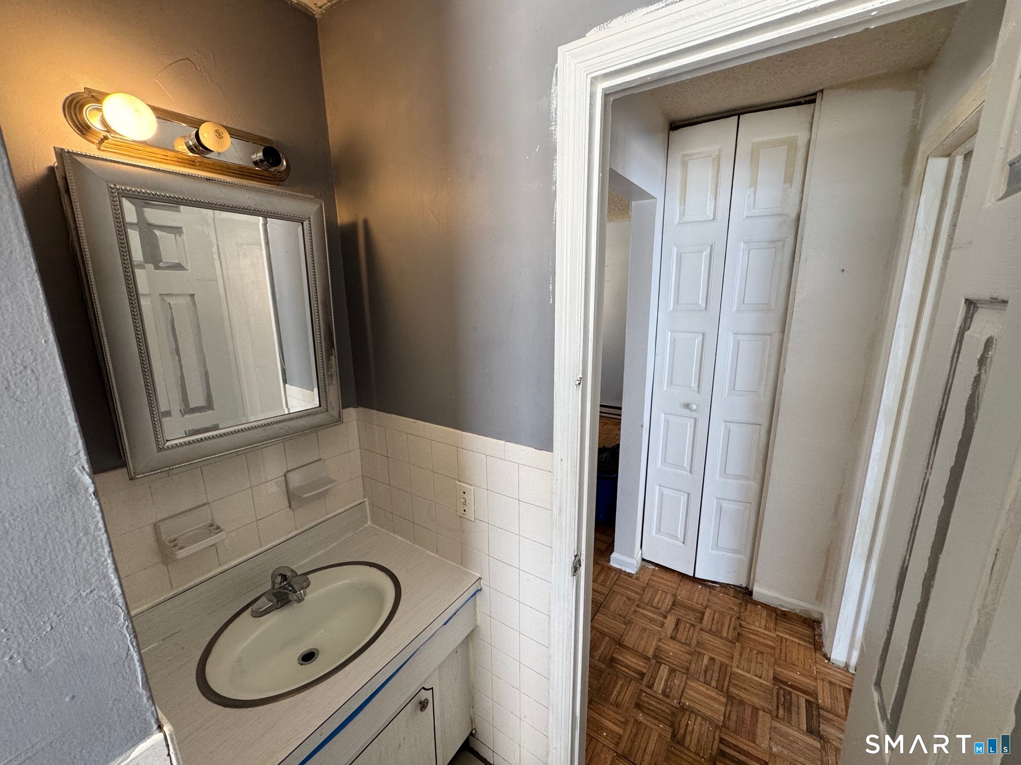 44 Abcd Angel Drive Waterbury, CT 06708 - Photo 12 of 20 a bathroom with a sink a toilet and mirror