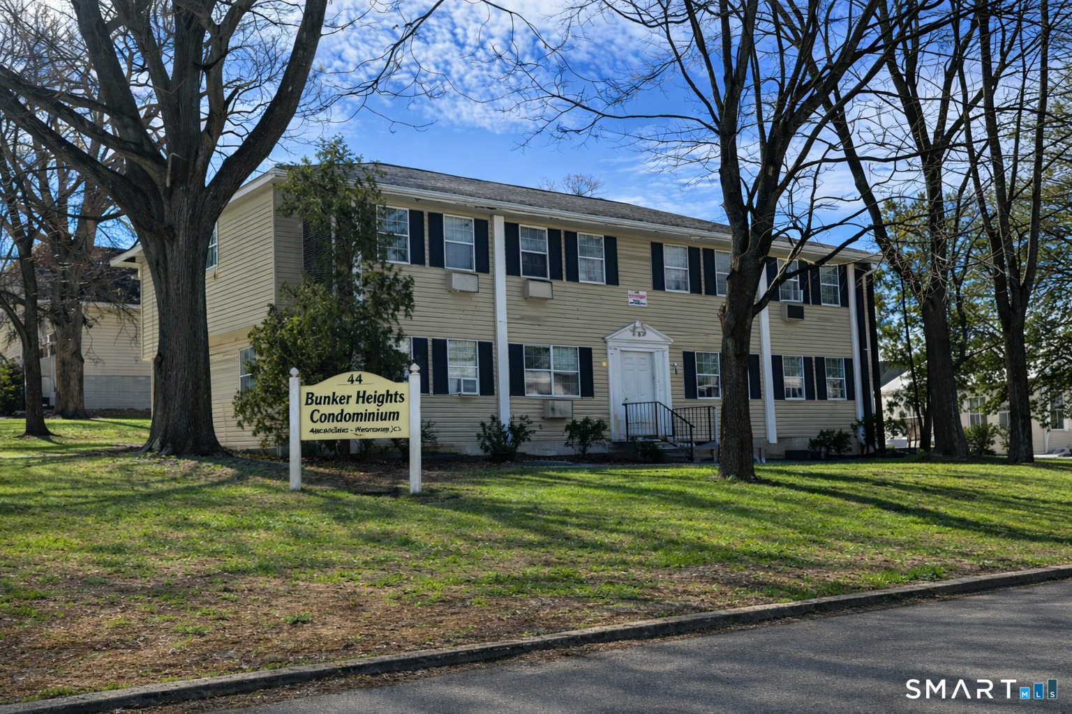 44 Abcd Angel Drive Waterbury, CT 06708 - Photo 15 of 20 a house view with a sitting space and garden