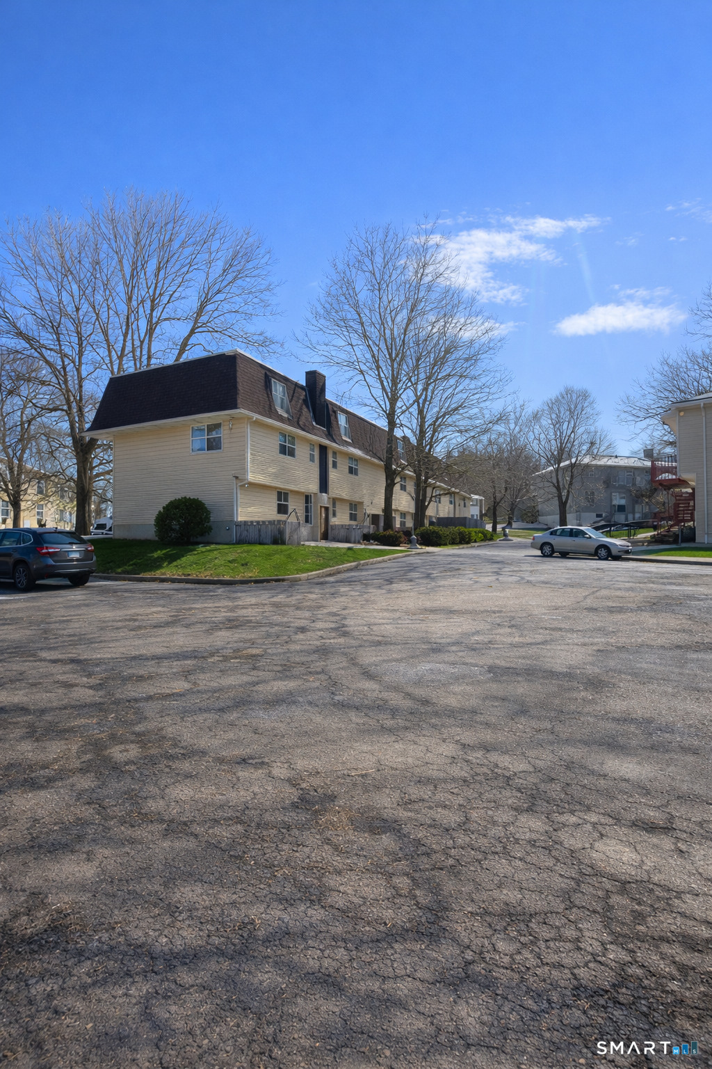 44 Abcd Angel Drive Waterbury, CT 06708 - Photo 18 of 20 a view of a yard with a house