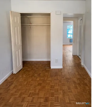 an empty room with entrance and door