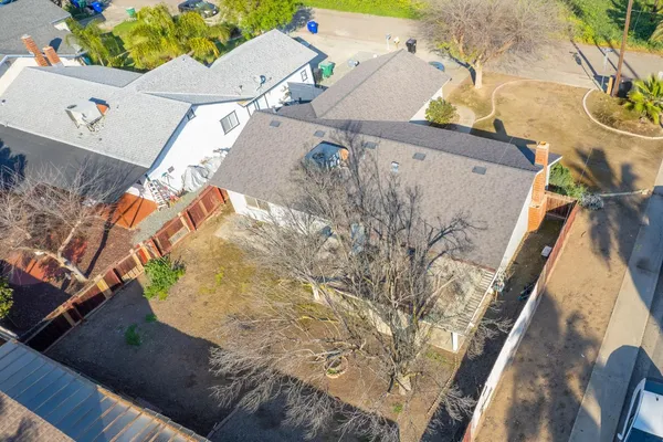 an aerial view of a house with a ocean view