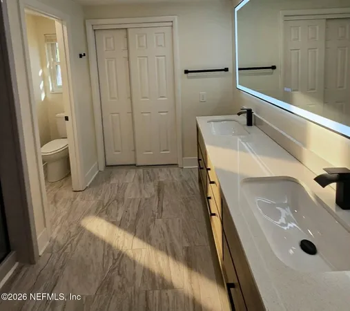 a bathroom with a sink and a washing machine