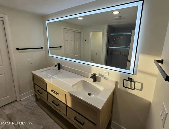 a bathroom with a sink and a mirror