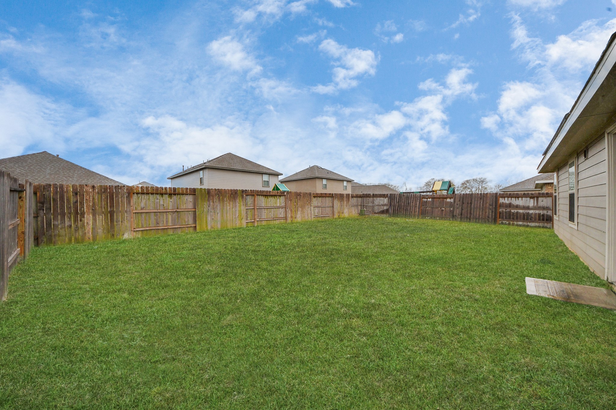 14606 Whitstone Gully Way Rosharon, TX 77583 - Photo 28 of 30 a view of a house with a big yard potted plants and large tree