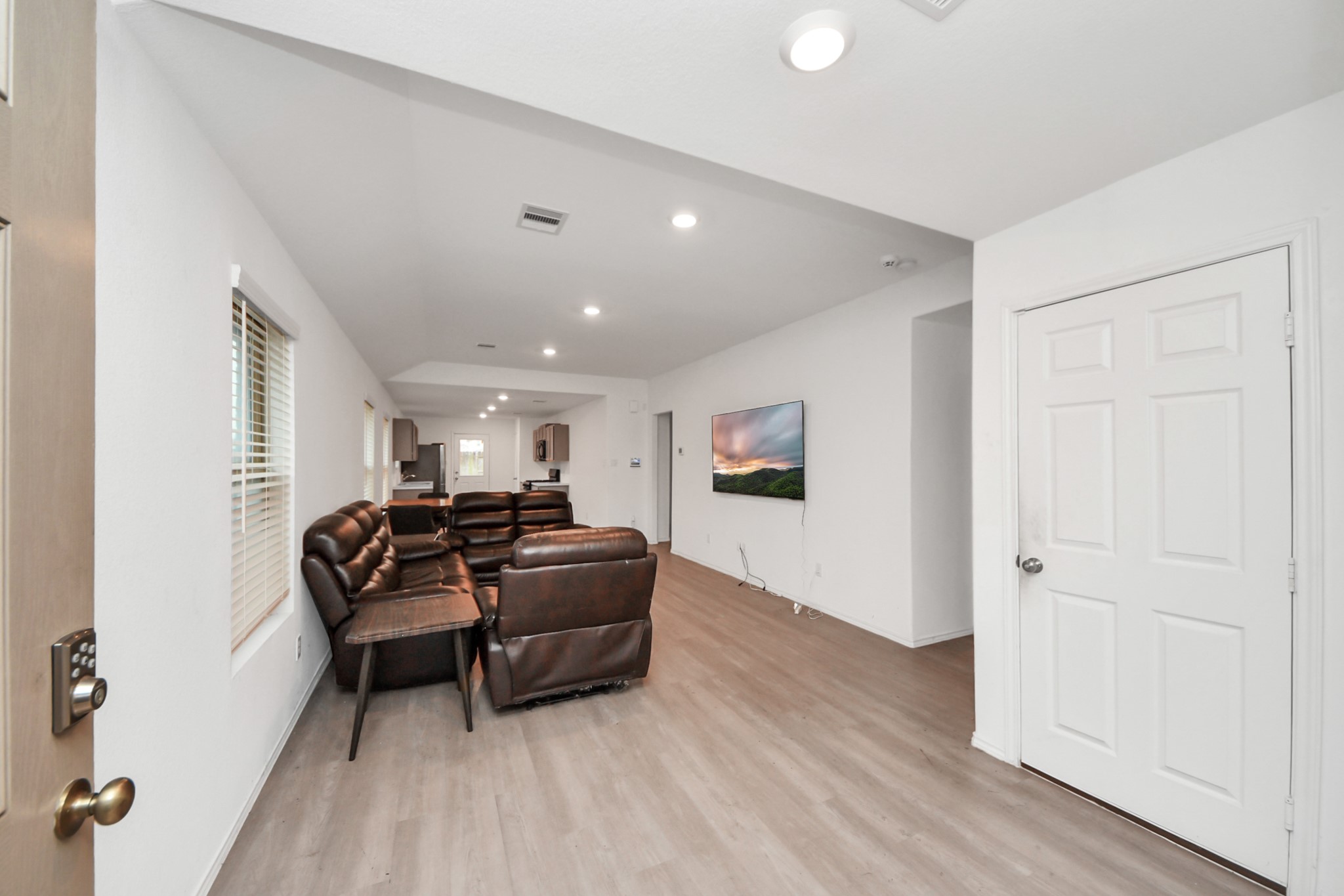 14606 Whitstone Gully Way Rosharon, TX 77583 - Photo 7 of 30 a living room with furniture and a wooden floor