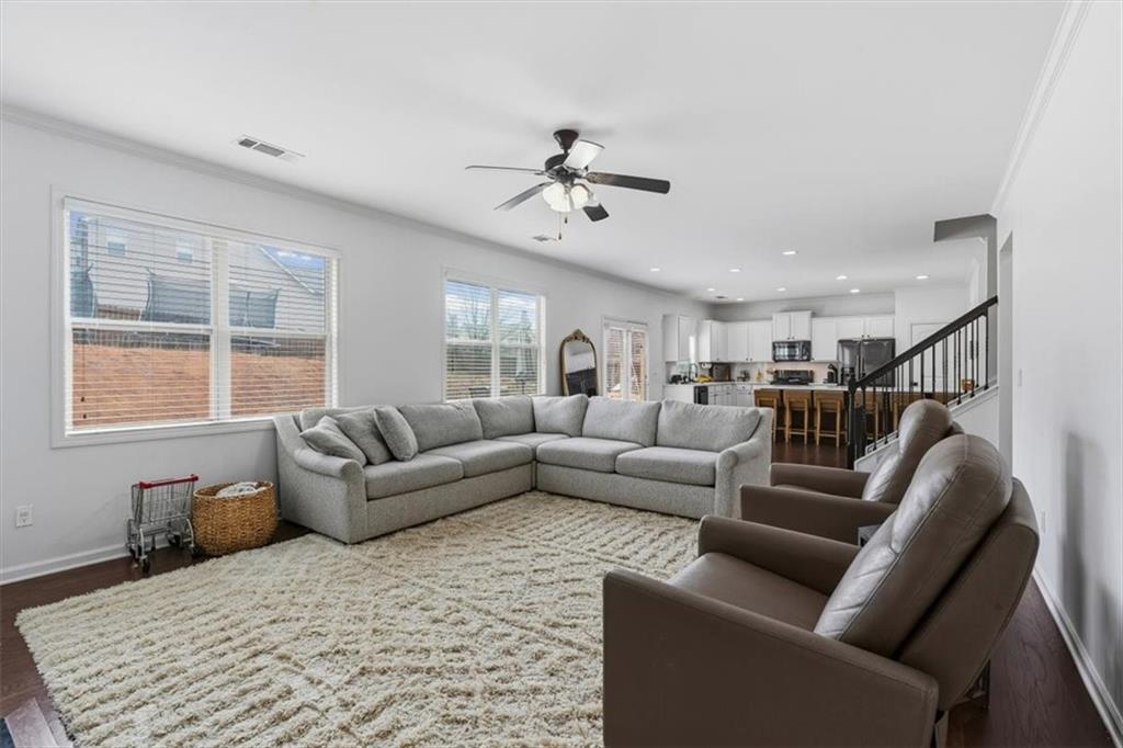1675 Cedar Mill Drive Powder Springs, GA 30127 - Photo 16 of 45 a living room with furniture and windows