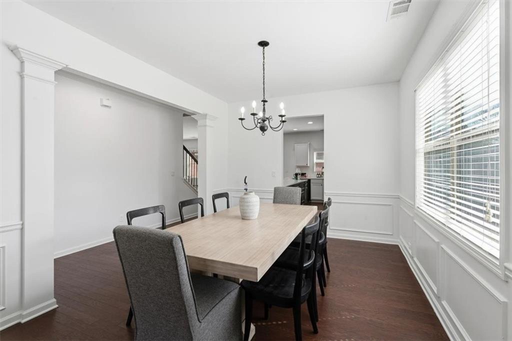 1675 Cedar Mill Drive Powder Springs, GA 30127 - Photo 18 of 45 a view of a dining room with furniture window and wooden floor
