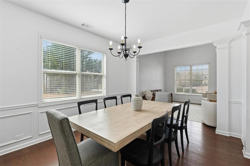 1675 Cedar Mill Drive Powder Springs, GA 30127 - Photo 19 of 45 a view of a dining room with furniture window and wooden floor