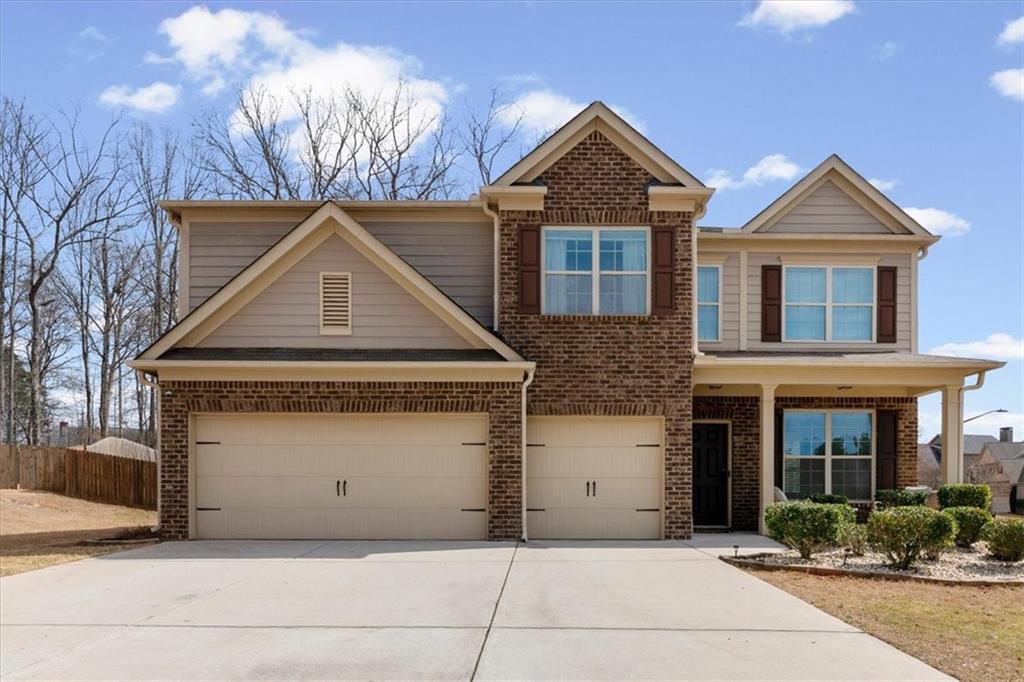 1675 Cedar Mill Drive Powder Springs, GA 30127 - Photo 2 of 45 a front view of a house with yard