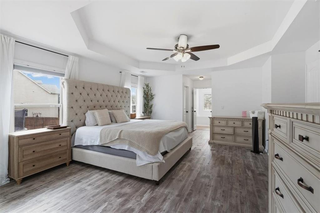 1675 Cedar Mill Drive Powder Springs, GA 30127 - Photo 21 of 45 a bedroom with a bed and a dresser