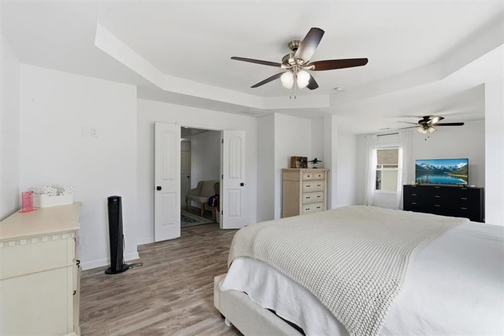 1675 Cedar Mill Drive Powder Springs, GA 30127 - Photo 22 of 45 a bedroom with a bed and a mirror