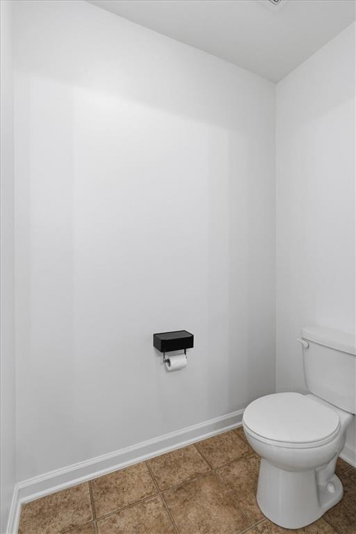 1675 Cedar Mill Drive Powder Springs, GA 30127 - Photo 29 of 45 a bathroom with a toilet