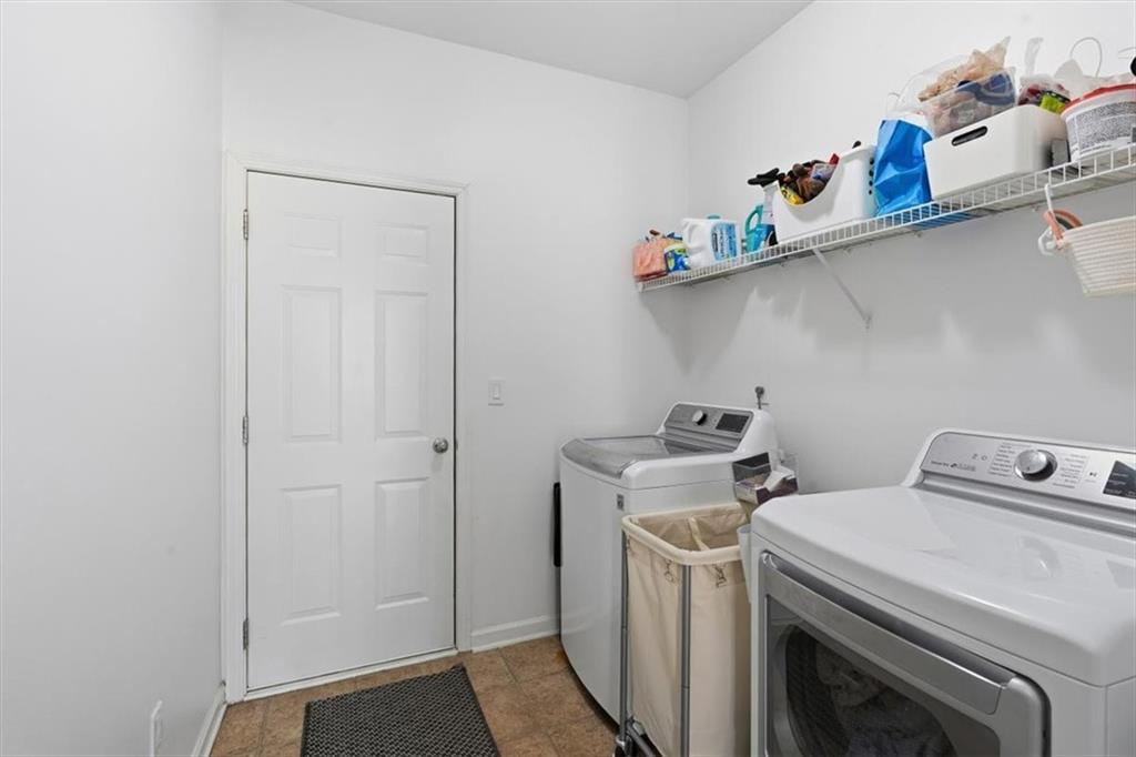 1675 Cedar Mill Drive Powder Springs, GA 30127 - Photo 40 of 45 a utility room with dryer and washer