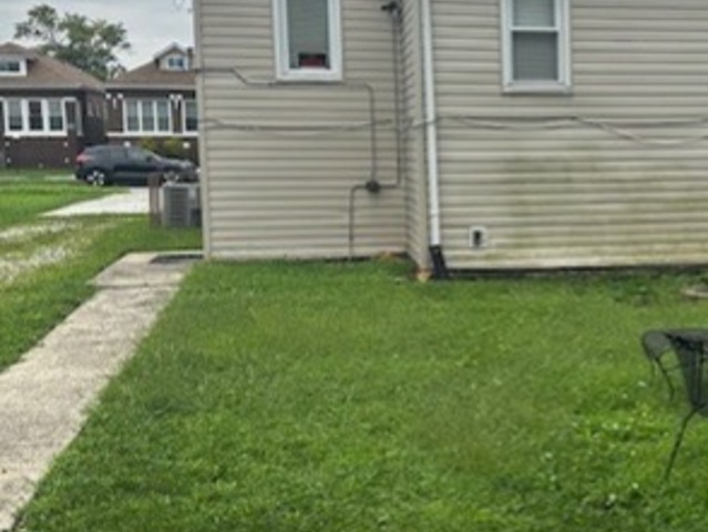 430 East 88th Place Chicago, IL 60619 - Photo 4 of 9 a view of a house with a backyard