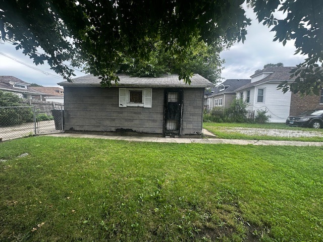 430 East 88th Place Chicago, IL 60619 - Photo 5 of 9 a front view of a house with a yard