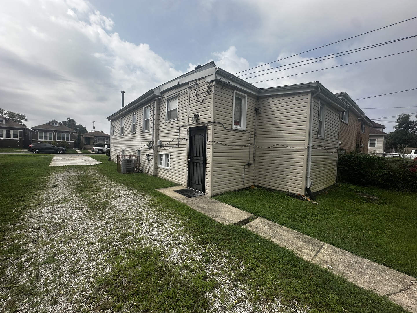 430 East 88th Place Chicago, IL 60619 - Photo 6 of 9 a view of a house with a yard