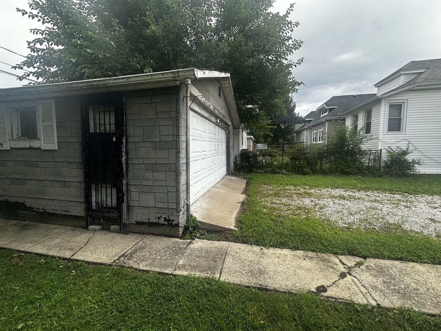 430 East 88th Place Chicago, IL 60619 - Photo 9 of 9 a front view of a house with garden