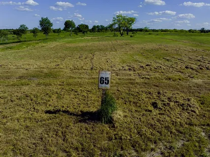 a view of a golf course with a house