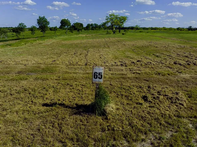 a view of a golf course with a house