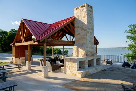 a view of house with yard and outdoor seating