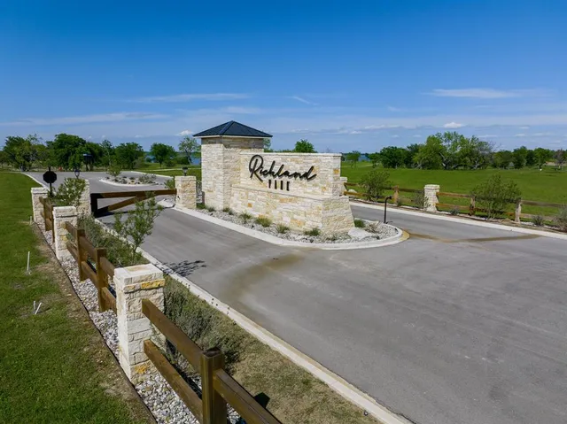 a view of a street with a building in the background