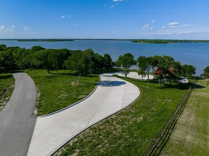 a view of a garden with lawn chairs