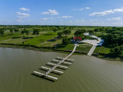 a view of a golf course with a lake