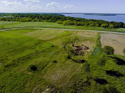 a view of a golf course with a lake