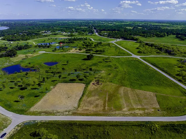 a view of a lake with a building in the background