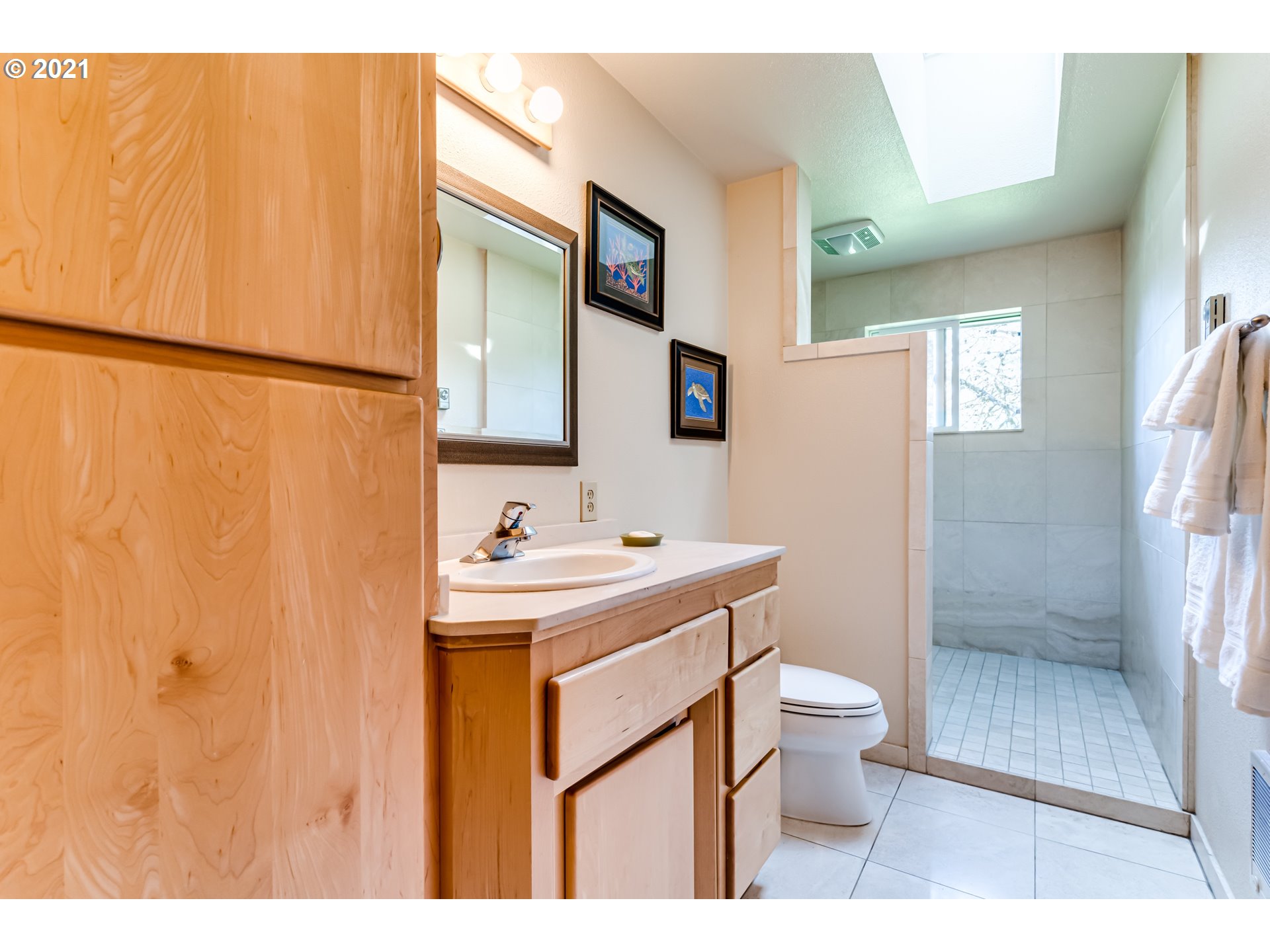 79385 Sears Road Cottage Grove, OR 97424 - Photo 13 of 32 a bathroom with a sink a toilet and shower