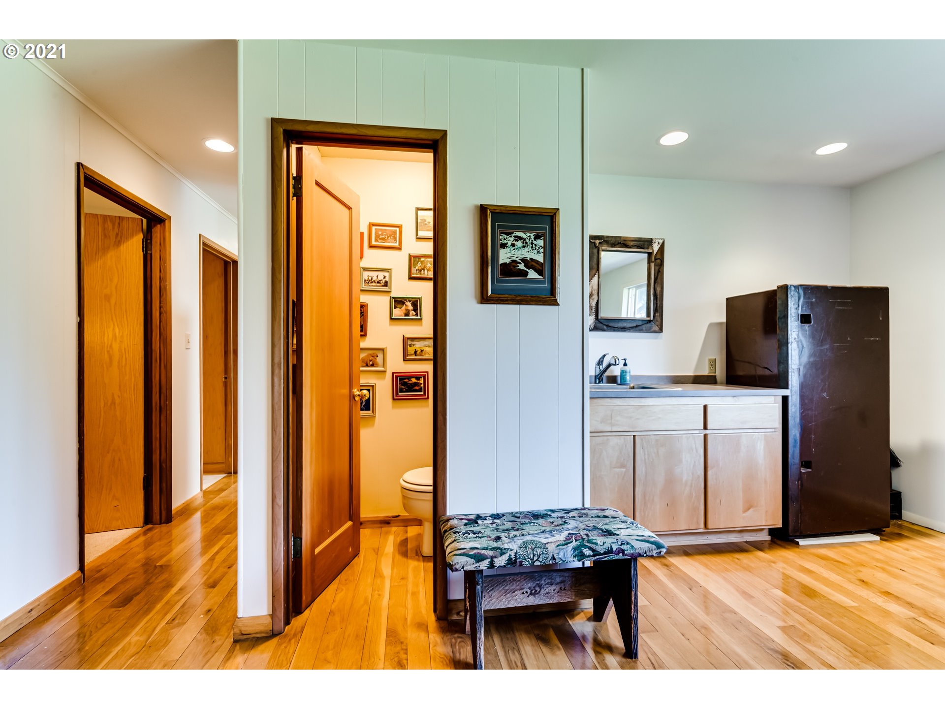 79385 Sears Road Cottage Grove, OR 97424 - Photo 18 of 32 a bedroom with a bed and a flat screen tv
